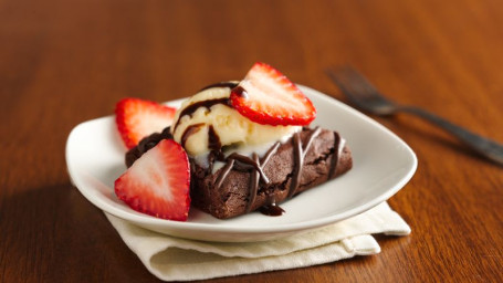 Brownie With Vanilla And Strawberry Toppings