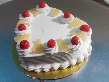 Eggless Pineapple Heart Speak Cake