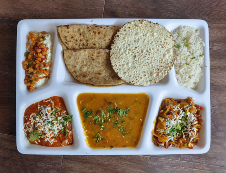 Deluxe Thali[Paneer Vegetable Vegetable Curry Dal Rice Roti (2 Pcs) Raita Papad Salad Buttermilk Sweet]