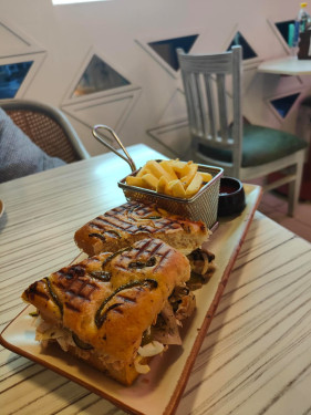 Rosemary And Olives Focaccia Sandwich With Grilled Mediterranean Veggies, Braise Onions And Cheese