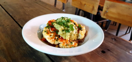 Grilled Cauliflower Steak On A Bed Of Mashed Potatoes