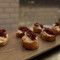 Crostini Con Baccalà Mantecato, Pomodorini Confit E Cipolla Caramellata